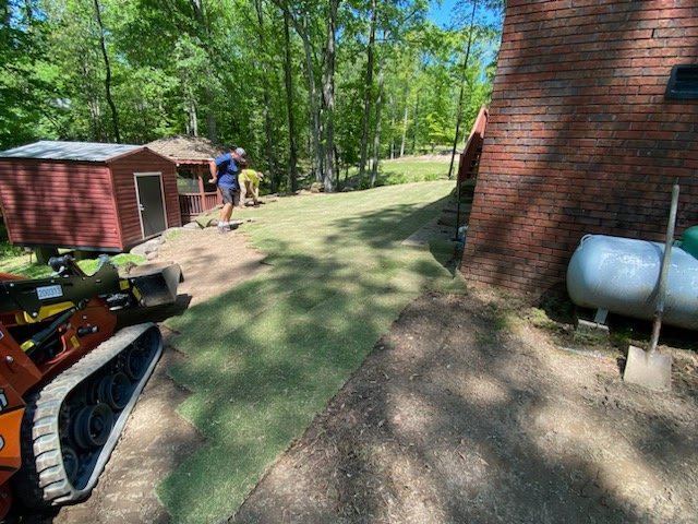 The Greenz crew laying sod on a residential property
