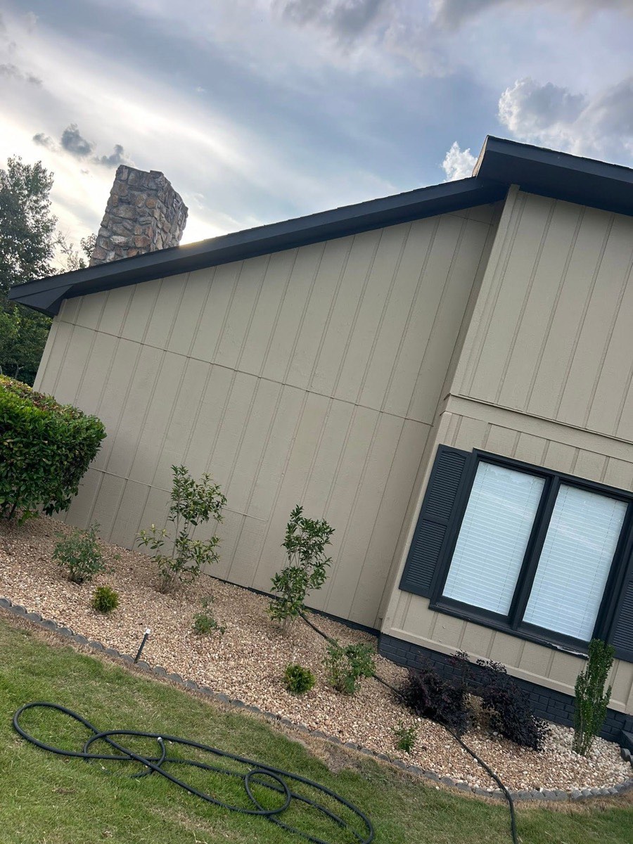 New plantings in a fresh rock bed along a home
